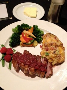 Duck with raspberry sauce and a twice baked potato